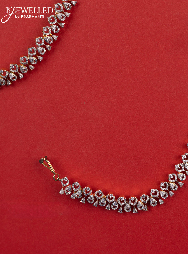 Zircon maatal with cz stones in gold finish