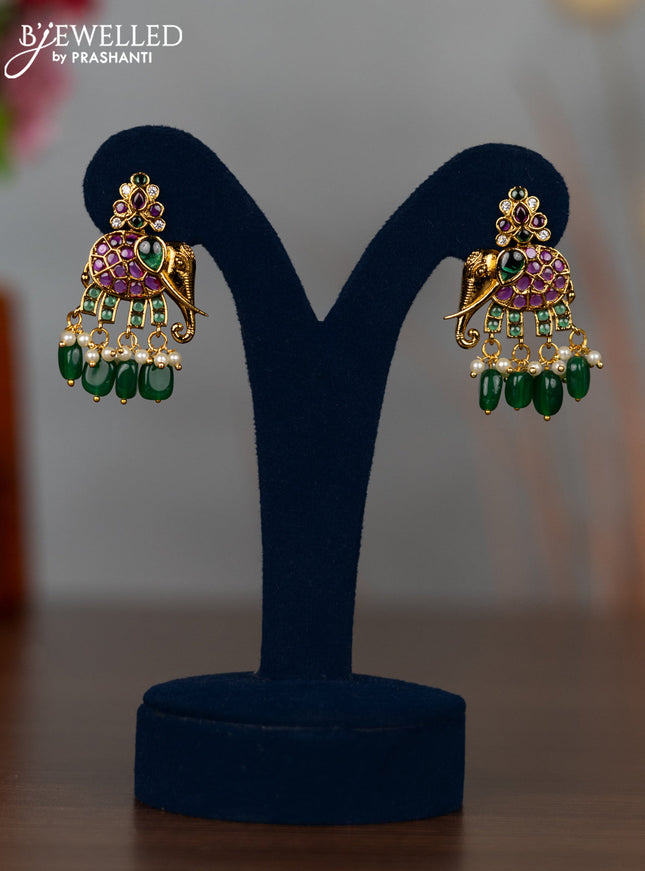Antique earrings elephant design with kemp & cz stones and pearl & green beads hangings