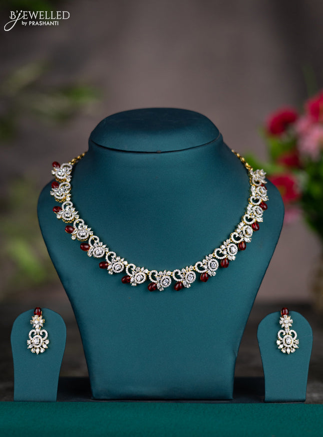 Zircon necklace with maroon beads and cz stones in gold finish