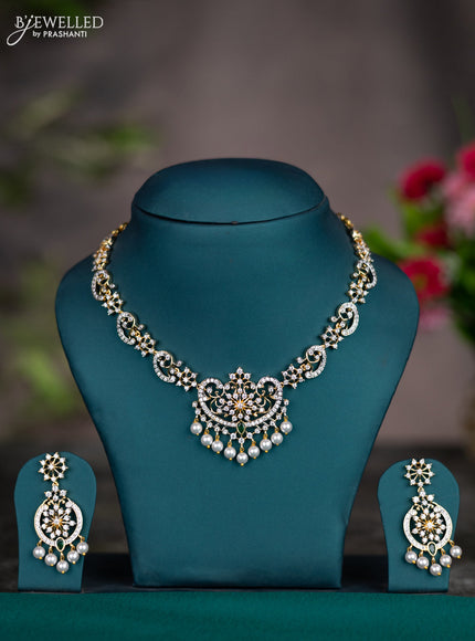 Zircon necklace with emerald & cz stones and pearl hangings in gold finish