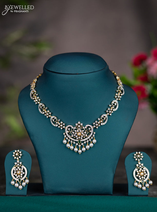 Zircon necklace with emerald & cz stones and pearl hangings in gold finish