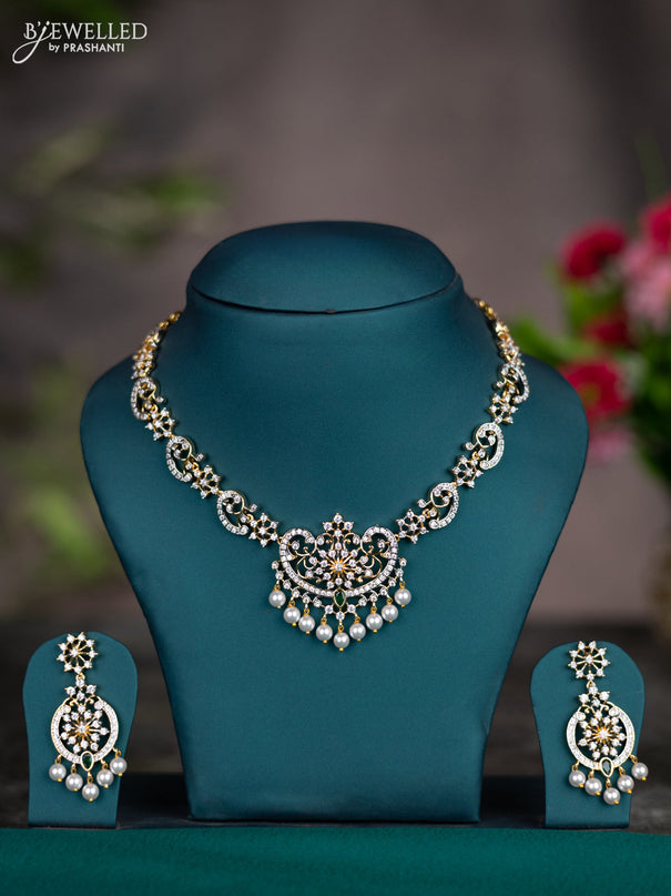 Zircon necklace with emerald & cz stones and pearl hangings in gold finish