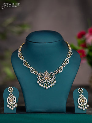 Zircon necklace with emerald & cz stones and pearl hangings in gold finish