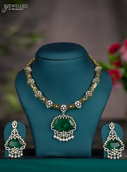 Zircon necklace with emerald & cz stones and pearl hangings in gold finish
