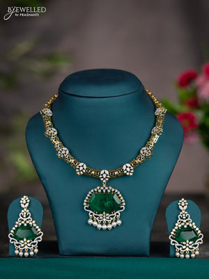 Zircon necklace with emerald & cz stones and pearl hangings in gold finish