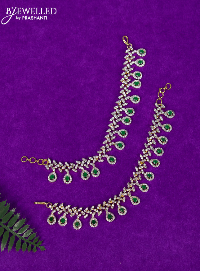 Zircon maatal with emerald and cz stones in gold finish