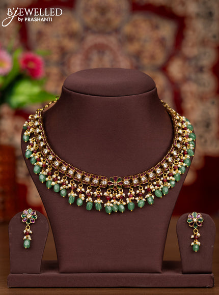 Antique necklace floral design with kemp & kundan stones and pearl & mint green beads hangings