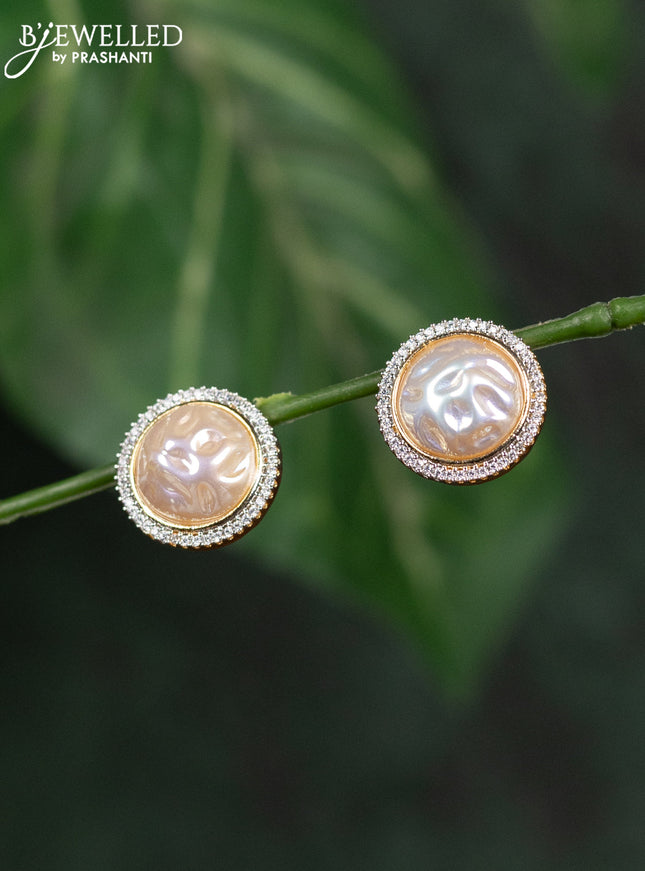 Zircon earrings with cz stones in gold finish