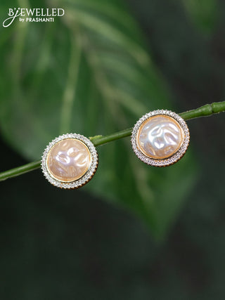 Zircon earrings with cz stones in gold finish