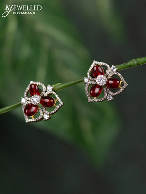 Zircon earrings with maroon beads and cz stones in gold finish