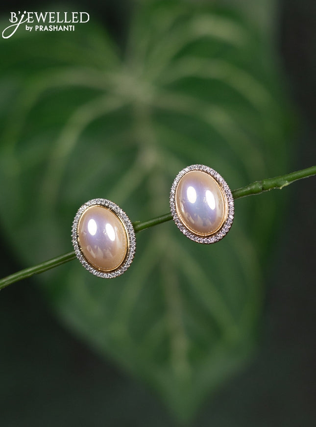 Zircon earrings with cz stones in gold finish