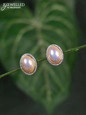 Zircon earrings with cz stones in gold finish