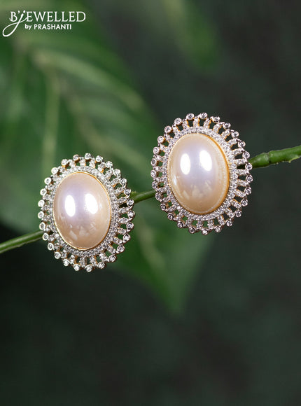 Zircon earrings with cz stones in gold finish