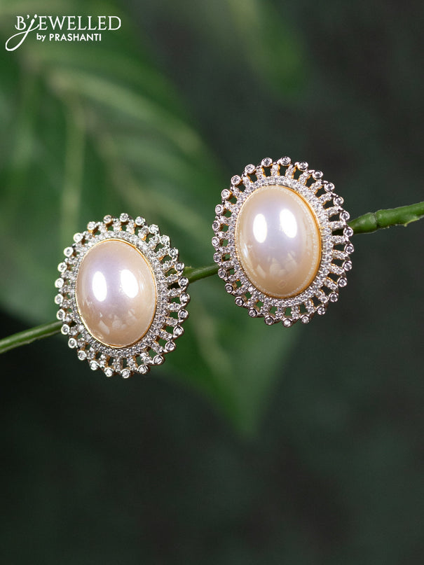 Zircon earrings with cz stones in gold finish