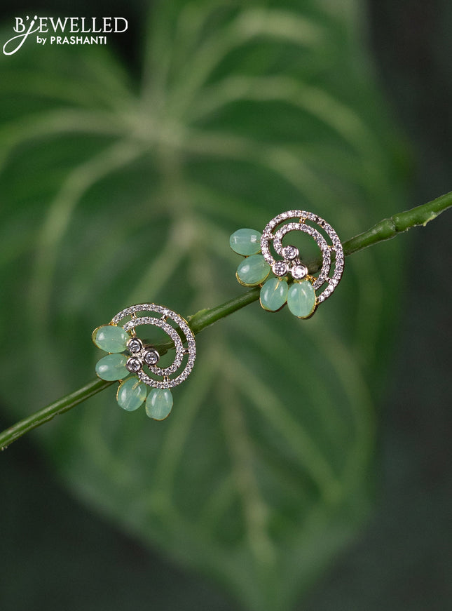 Zircon earrings with mint green beads and cz stones in gold finish
