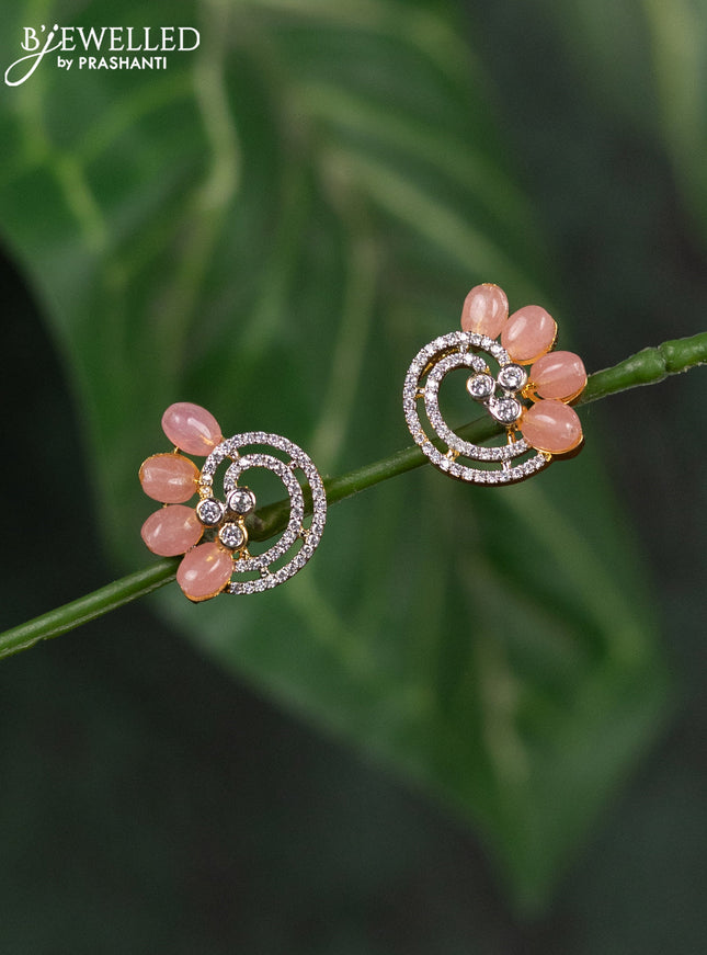 Zircon earrings with baby pink beads and cz stones in gold finish