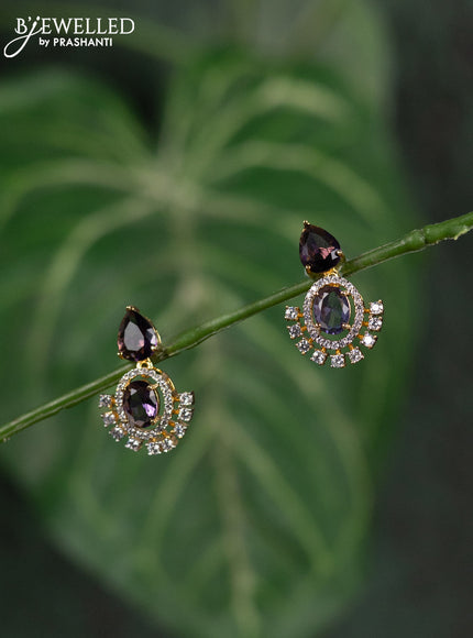 Zircon earrings with purple and cz stones in gold finish