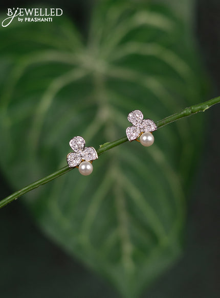 Zircon earrings leaf design with cz stones and pearl in gold finish
