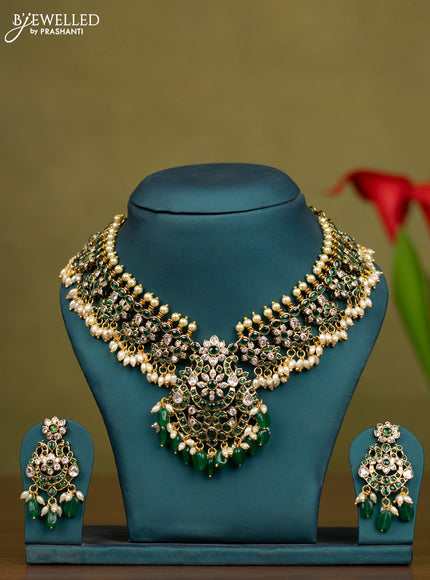 Necklace with emerald & kundan stones and pearl & green beads hangings in victorian finish