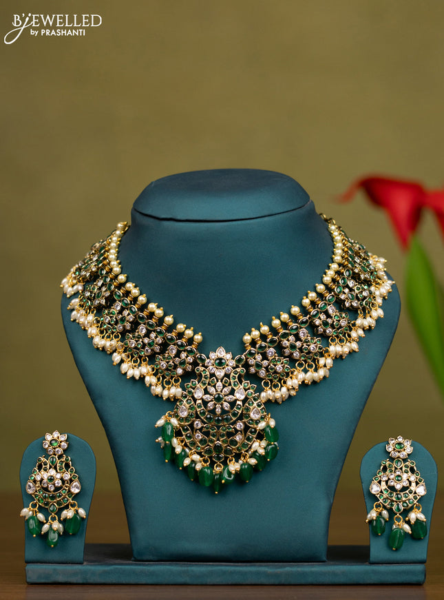 Necklace with emerald & kundan stones and pearl & green beads hangings in victorian finish