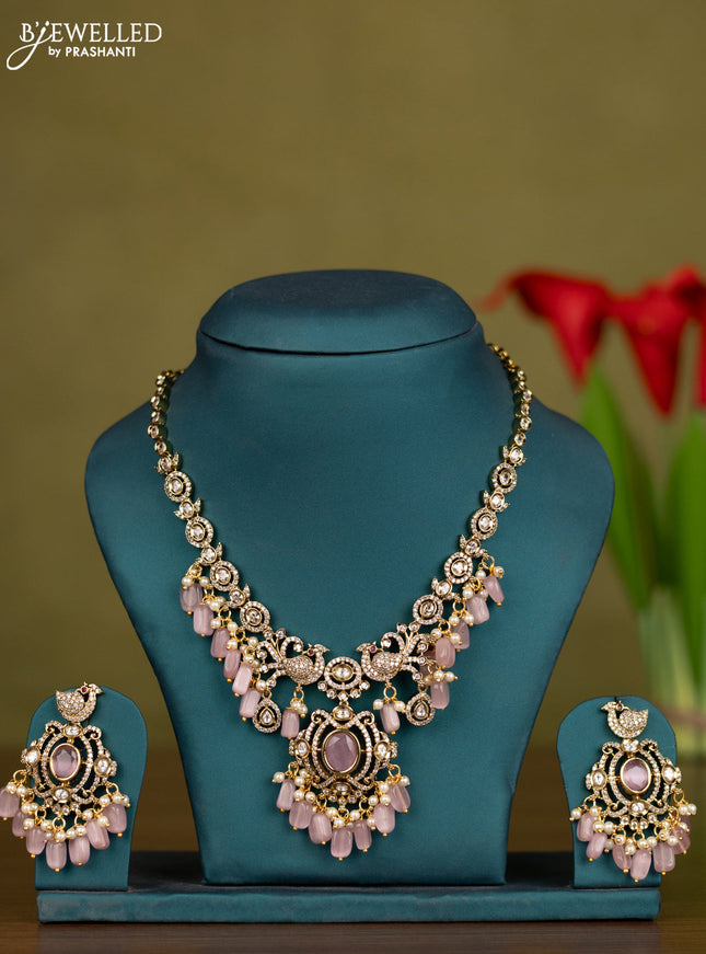Necklace peacock design with baby pink & kundan cz stones and pearl & beads hangings in victorian finish
