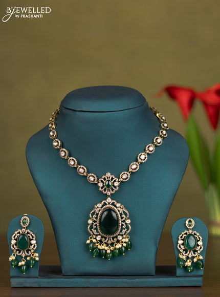 Necklace with emerald & kundan cz stones and pearl & green beads hangings in victorian finish