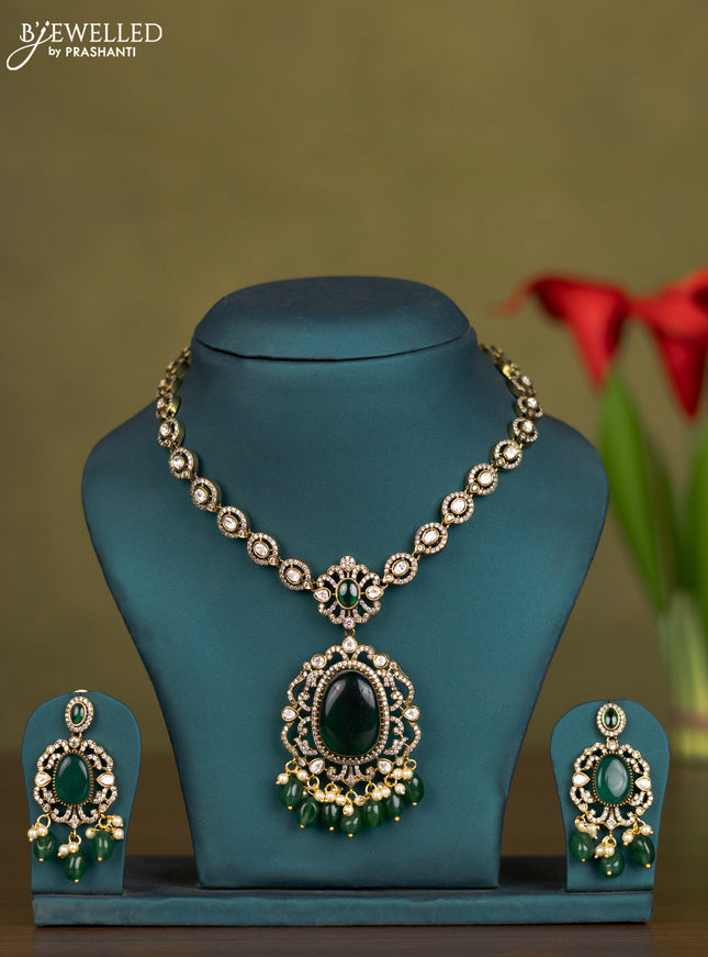 Necklace with emerald & kundan cz stones and pearl & green beads hangings in victorian finish
