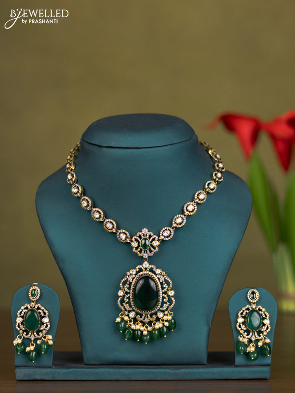 Necklace with emerald & kundan cz stones and pearl & green beads hangings in victorian finish