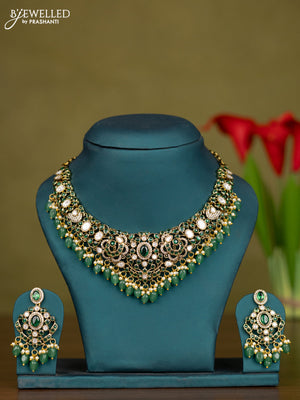 Necklace with emerald & kundan cz stones and green beads hangings in victorian finish