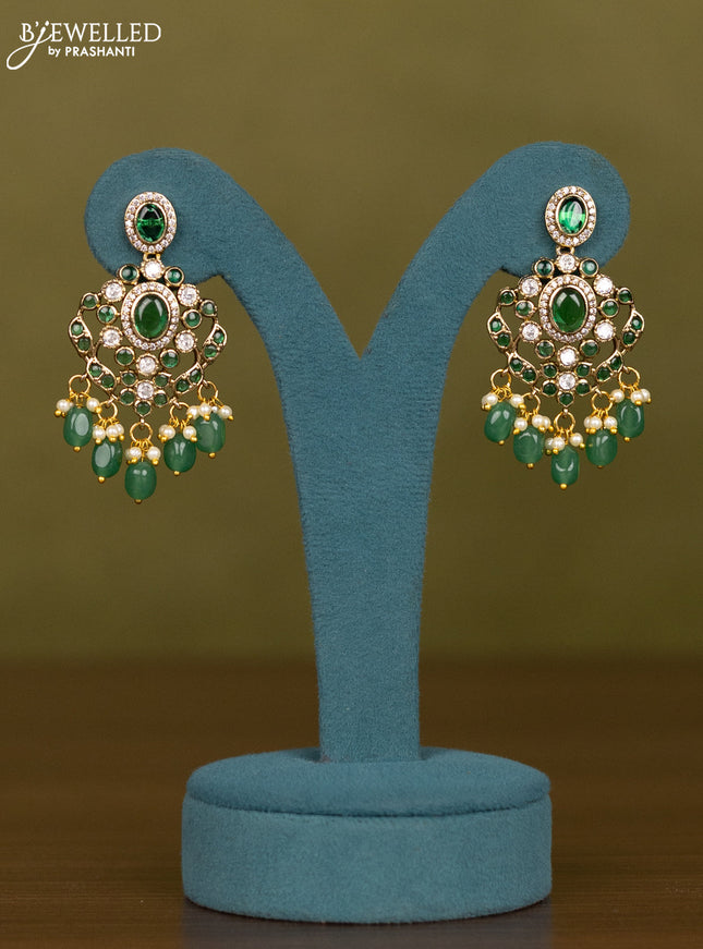 Necklace with emerald & kundan cz stones and green beads hangings in victorian finish