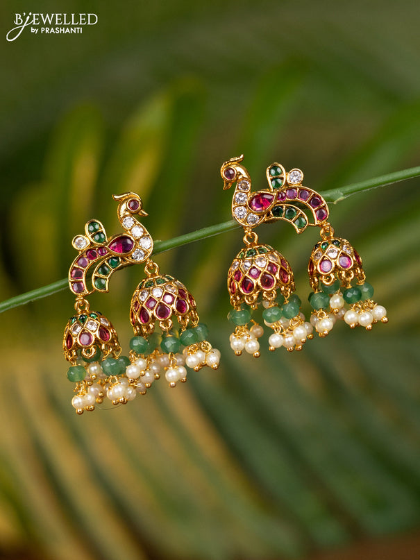 Antique jhumka peacock design with kemp & cz stones and pearl & mint green beads hangings