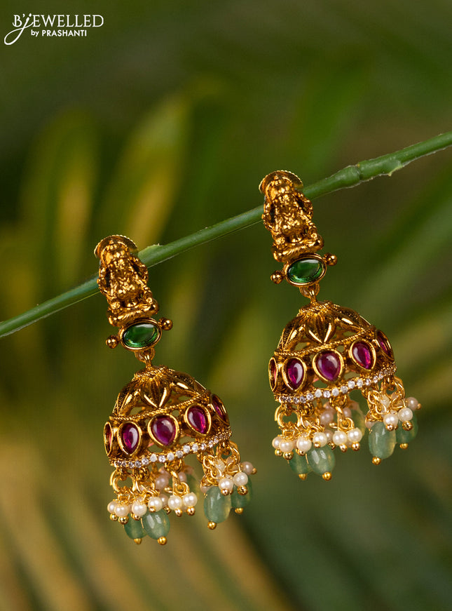 Antique jhumka lakshmi design with kemp & cz stones and pearl & mint green beads hangings