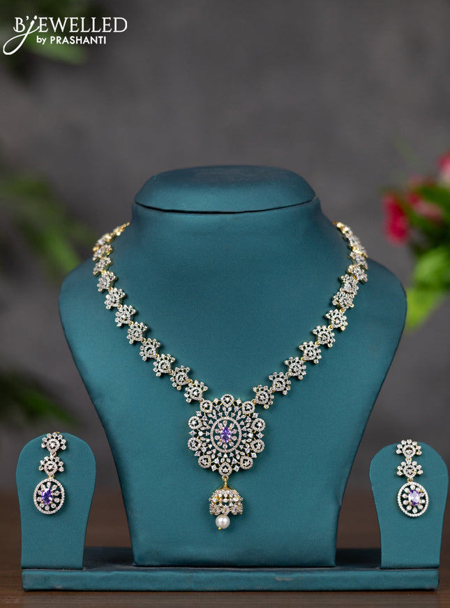 Zircon necklace with purple & cz stones and pearl hnaging in gold finish