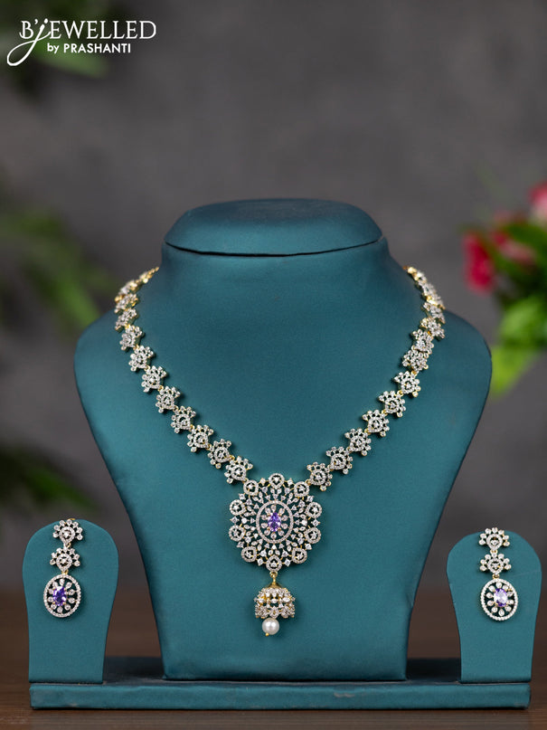 Zircon necklace with purple & cz stones and pearl hnaging in gold finish
