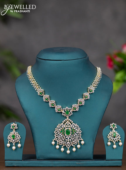 Zircon necklace with emerald & cz stones and pearl hangings in gold finish