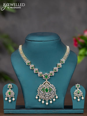 Zircon necklace with emerald & cz stones and pearl hangings in gold finish