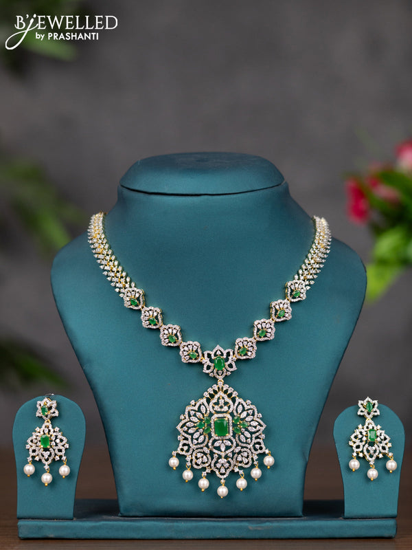 Zircon necklace with emerald & cz stones and pearl hangings in gold finish