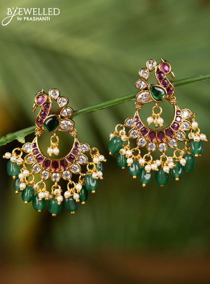 Antique earrings peacock design with kemp & kundan stones and pearl & green beads hangings