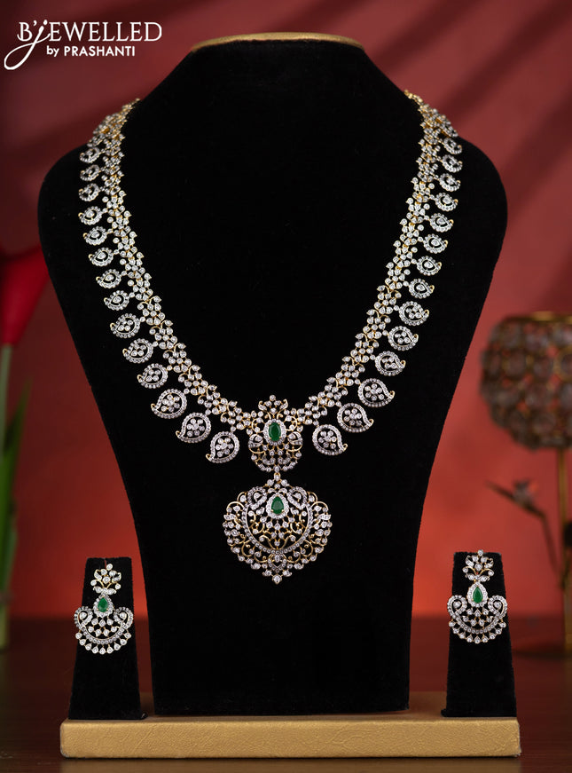 Zircon haaram manga pattern with emerald and cz stones in gold finish