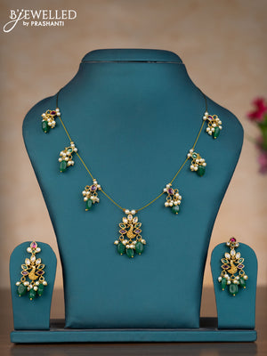 Invisible chain peacock design with kemp & kundan stones and pearl & green beads hangings