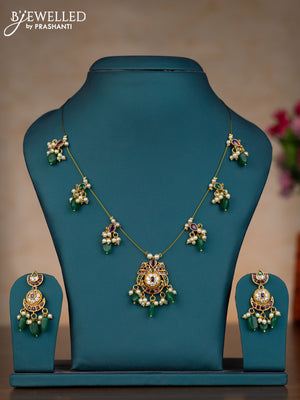 Invisible chain chandbali design with kemp & cz stones and pearl & green beads hangings