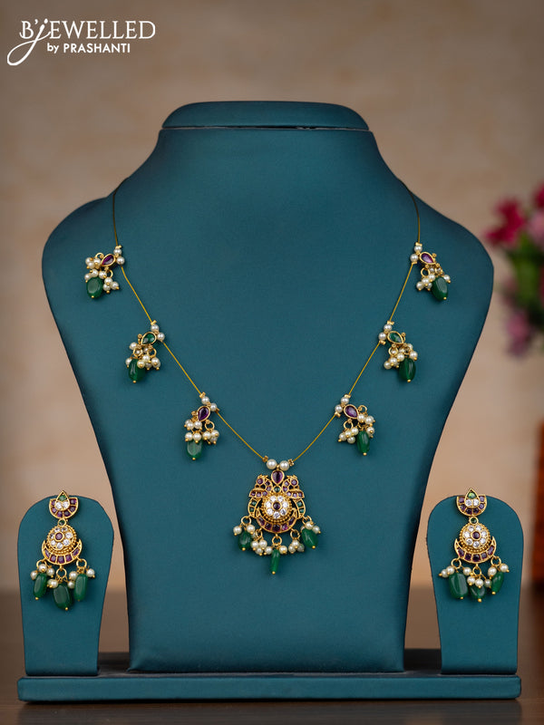 Invisible chain chandbali design with kemp & cz stones and pearl & green beads hangings