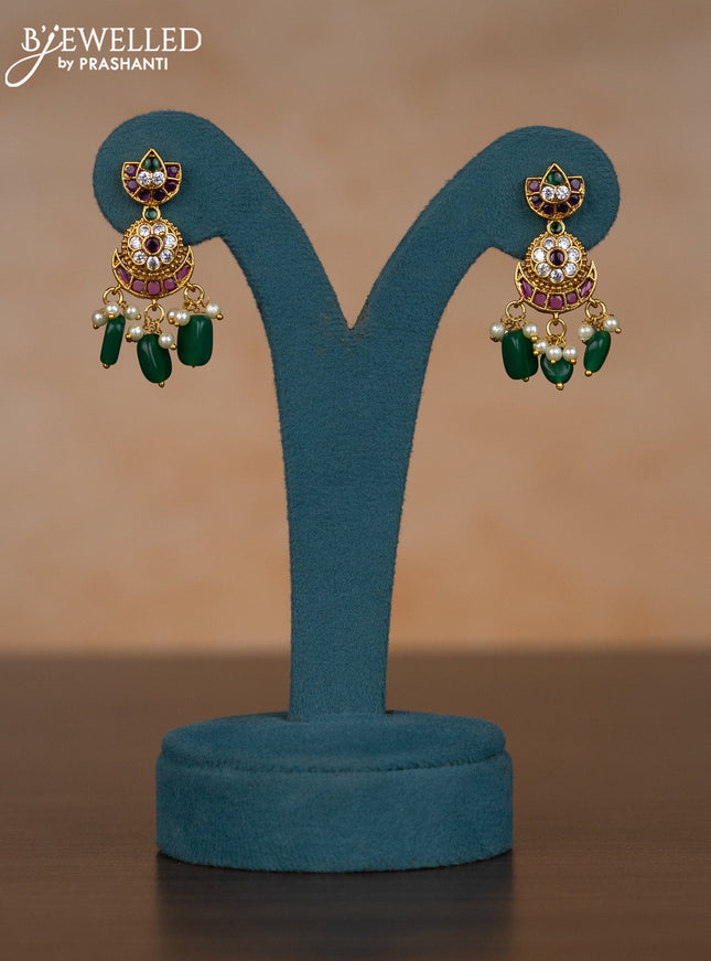 Invisible chain chandbali design with kemp & cz stones and pearl & green beads hangings