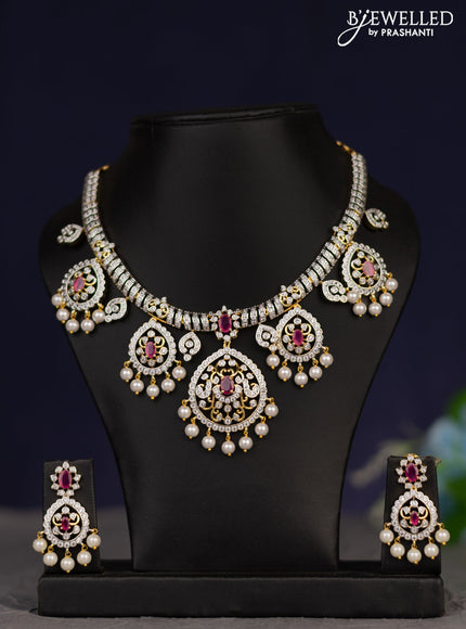 Zircon necklace with ruby & cz stones and pearl hangings in gold finish