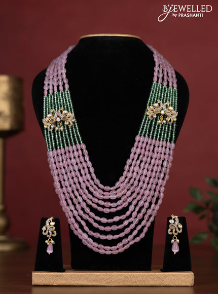 Beaded multilayer haaram with peacock side pendant and kundan & cz stones