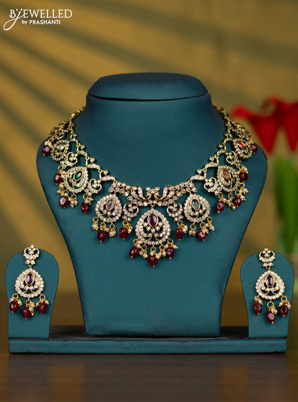 Necklace with multicolour & cz stones and pearl & maroon beads hangings in victorian finish