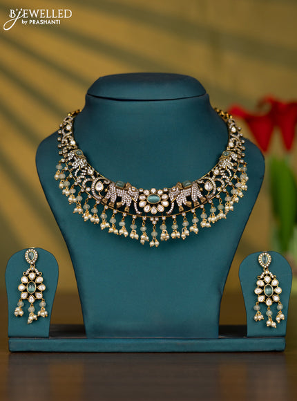 Necklace elephant design with mint green & kundan cz stones and pearl hangings in victorian finish