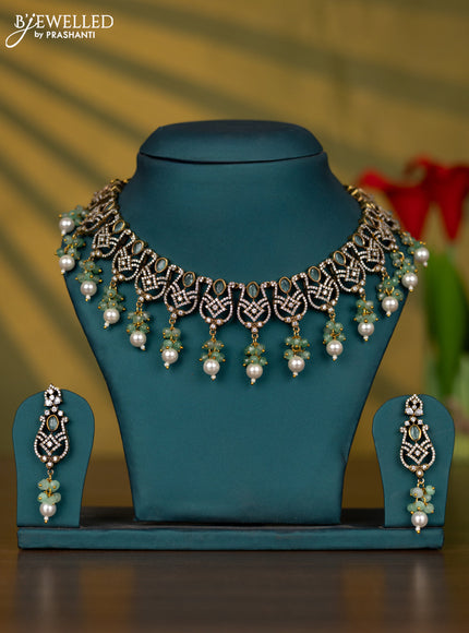 Necklace with mint green & cz stones and pearl & beads hangings in victorian finish