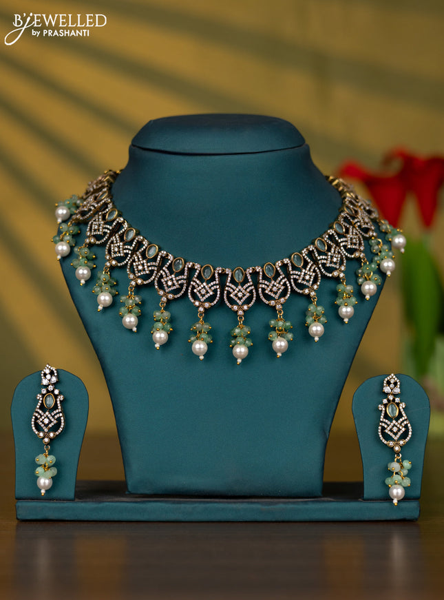Necklace with mint green & cz stones and pearl & beads hangings in victorian finish
