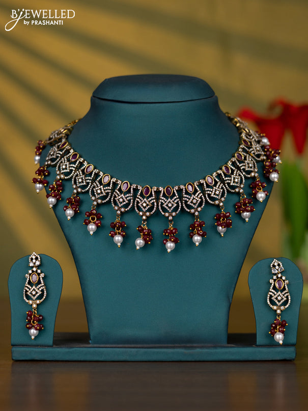 Necklace with ruby & cz stones and pearl & beads hangings in victorian finish